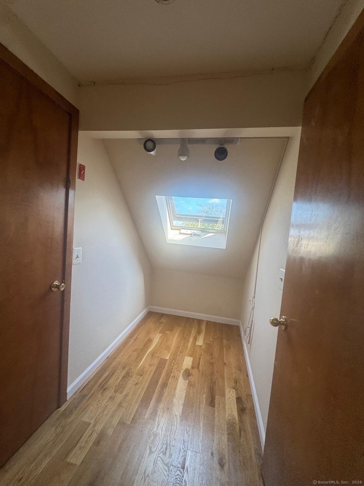 204 Wheeler Avenue, Unit 6 Bridgeport, CT 06606 - Photo 8 of 15 wooden floor in an empty room