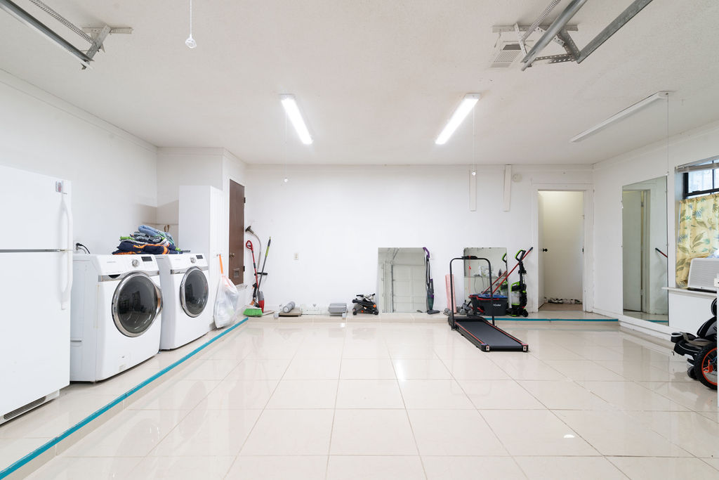 1106 Saucedo Street Austin, TX 78721 - Photo 11 of 34 Enclosed garage with freestanding refrigerator