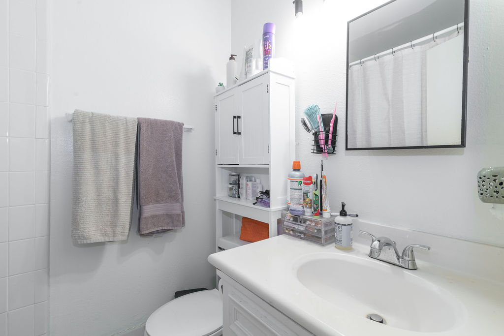 1106 Saucedo Street Austin, TX 78721 - Photo 21 of 34 Full bathroom with vanity and a shower located in owners suite.