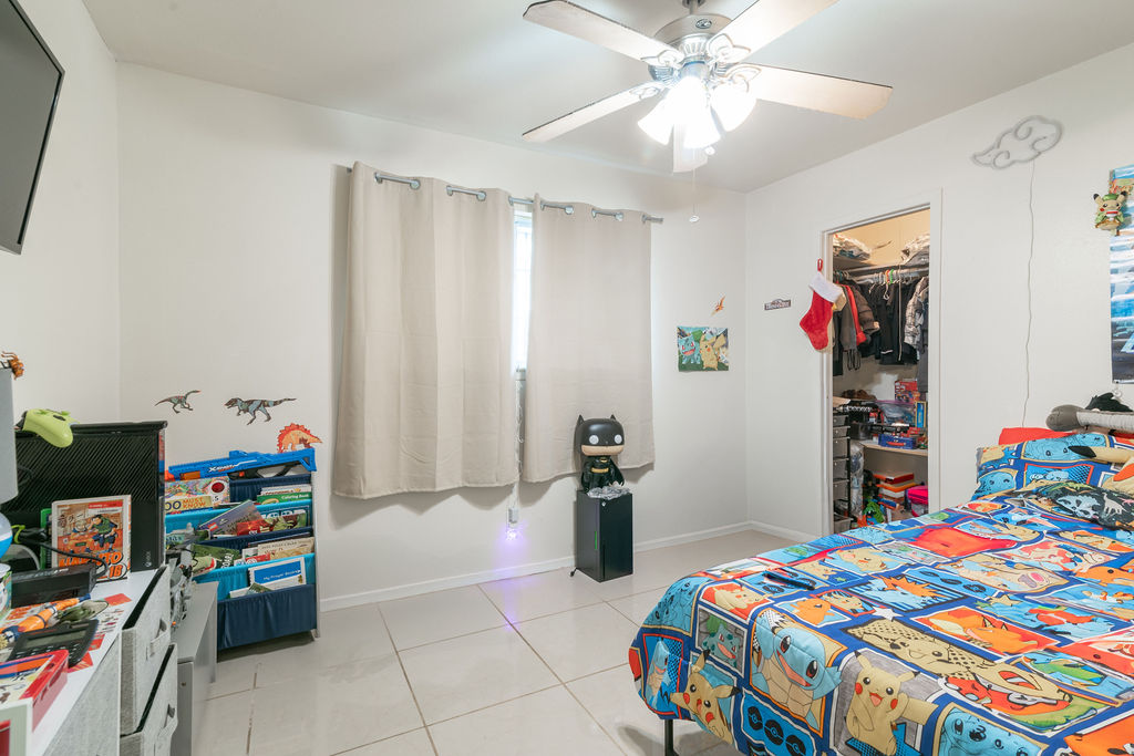 1106 Saucedo Street Austin, TX 78721 - Photo 22 of 34 Bright and playful bedroom with closet space—ready for rest, fun, or future rental guests.