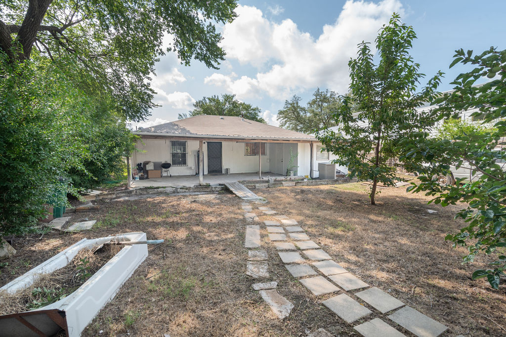 1106 Saucedo Street Austin, TX 78721 - Photo 29 of 34 Spacious backyard with shaded potential—ripe for a lush garden or weekend grilling getaway.