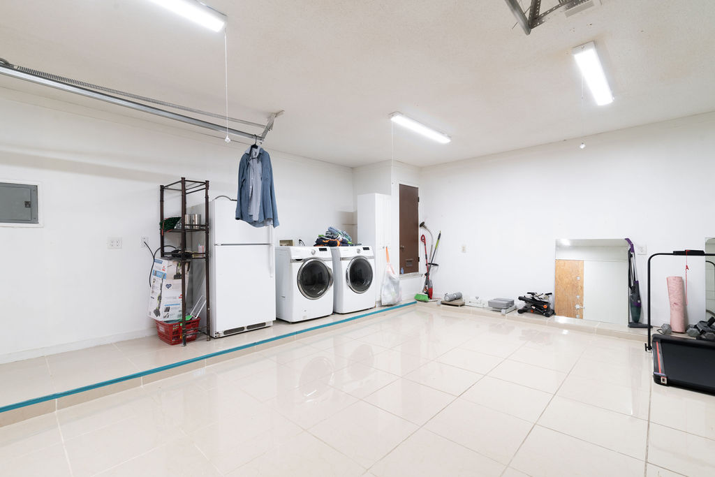 1106 Saucedo Street Austin, TX 78721 - Photo 9 of 34 Laundry room area electric panel, and tile patterned floors