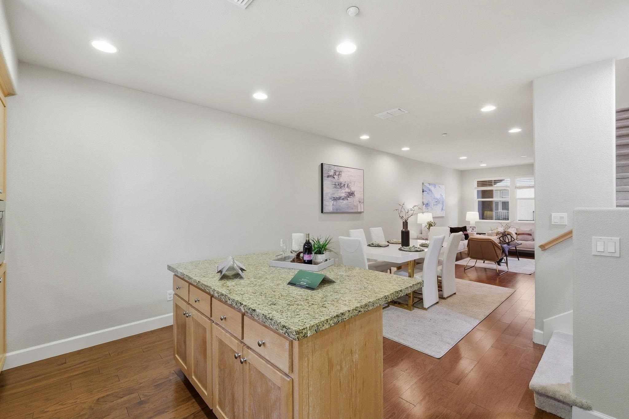 2863 Finca Terrace Fremont, CA 94539 - Photo 11 of 37 a view of kitchen island with granite countertop living room