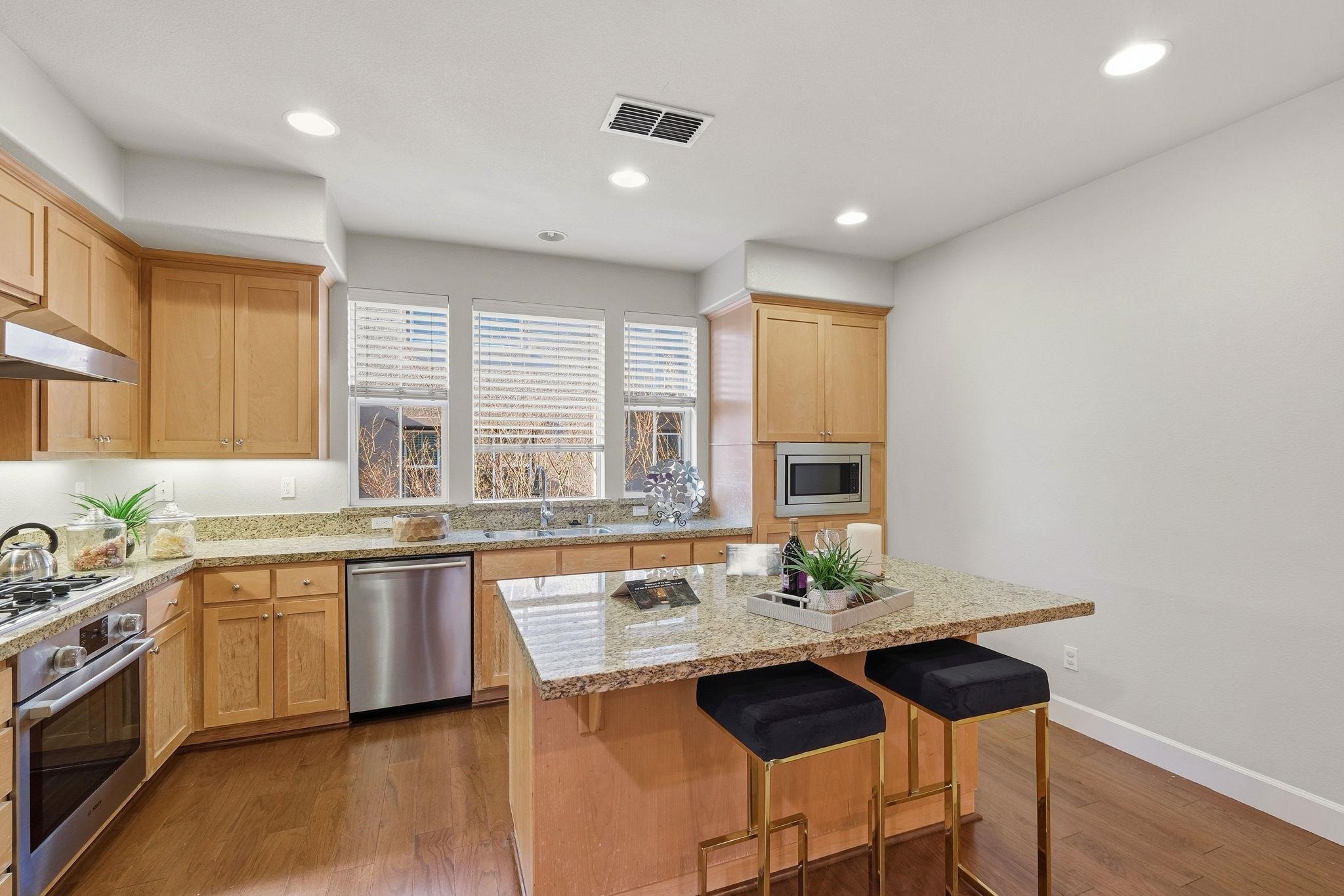 2863 Finca Terrace Fremont, CA 94539 - Photo 12 of 37 a kitchen with a stove a sink and a refrigerator
