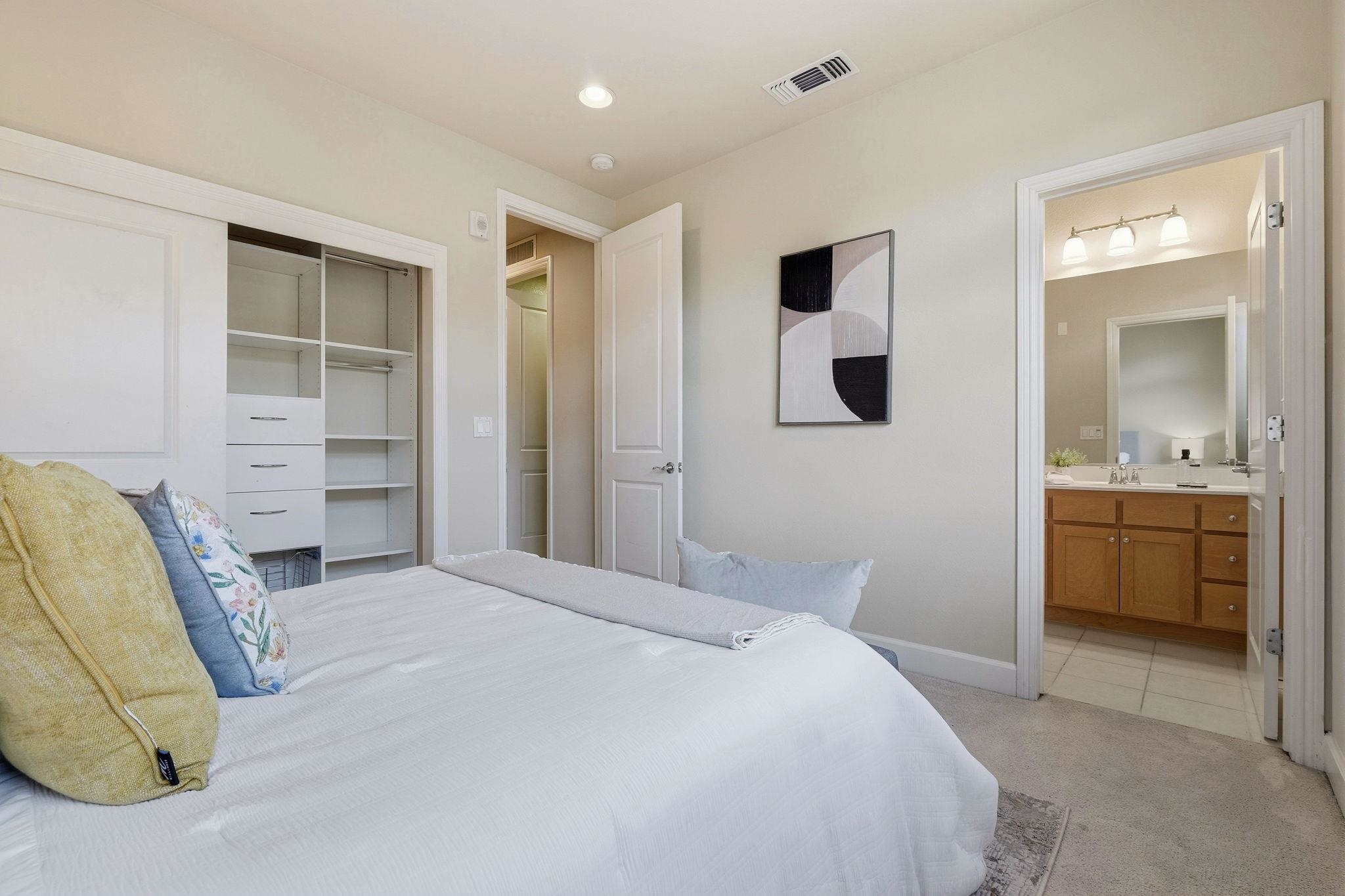 2863 Finca Terrace Fremont, CA 94539 - Photo 18 of 37 a bedroom with a bed and a view of living room
