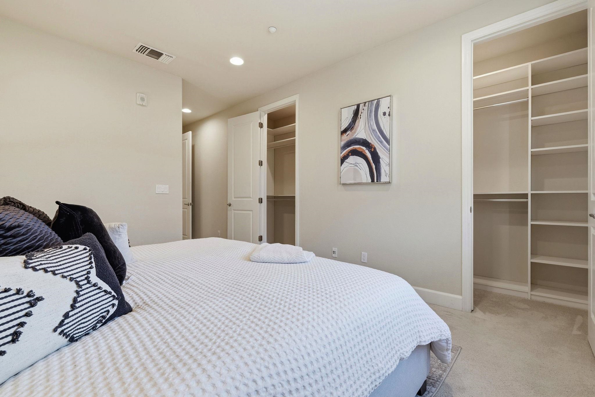 2863 Finca Terrace Fremont, CA 94539 - Photo 20 of 37 a bedroom with a bed and closet