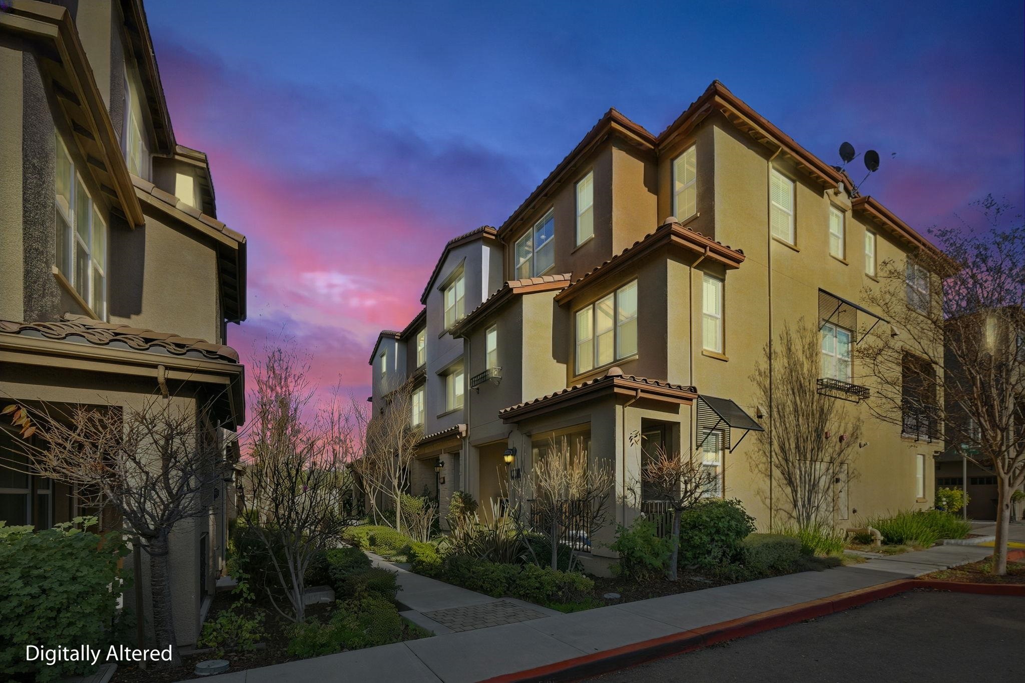 2863 Finca Terrace Fremont, CA 94539 - Photo 2 of 37 a front view of a residential apartment building with a yard