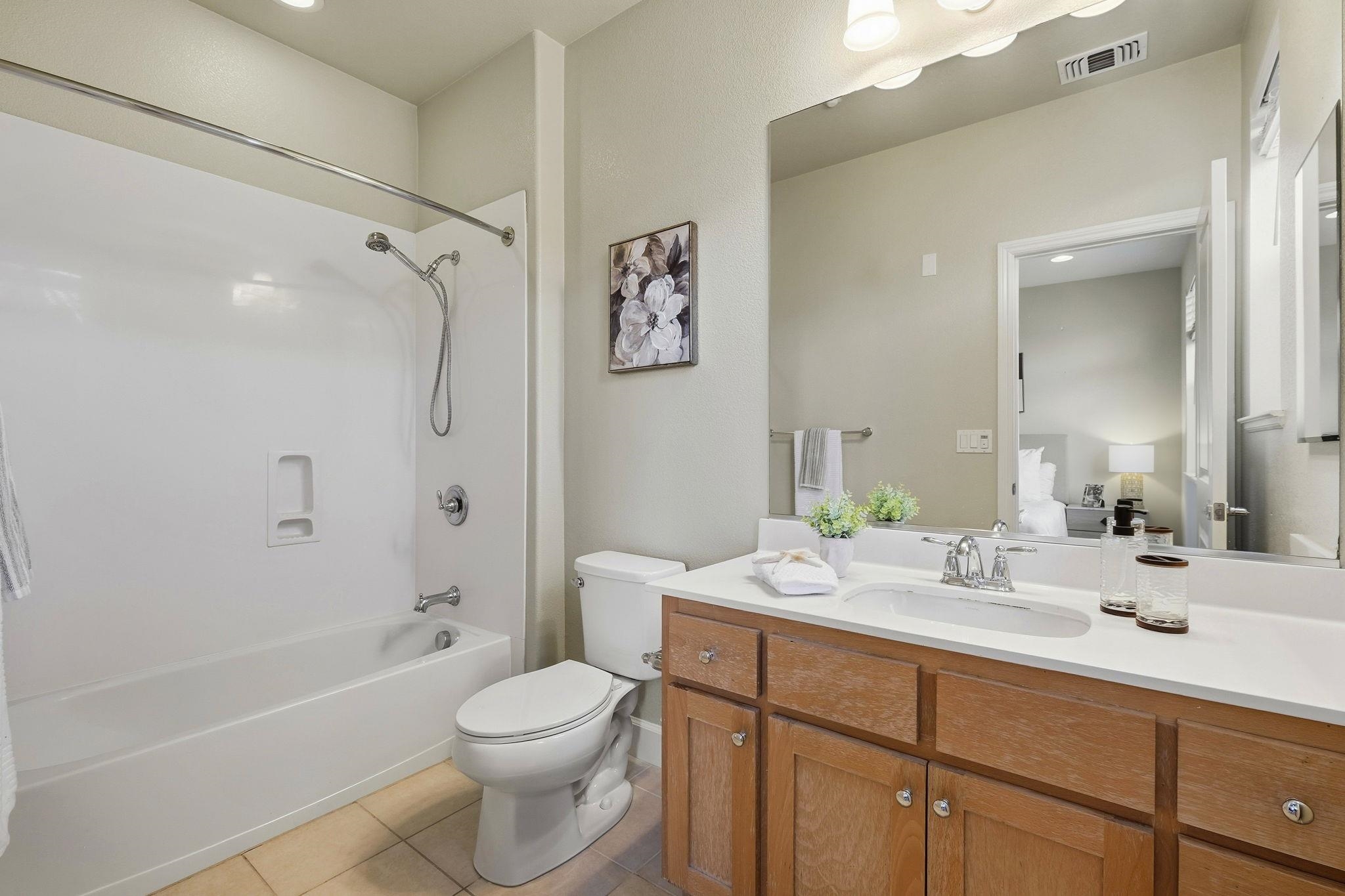 2863 Finca Terrace Fremont, CA 94539 - Photo 24 of 37 a bathroom with a double vanity sink toilet and shower