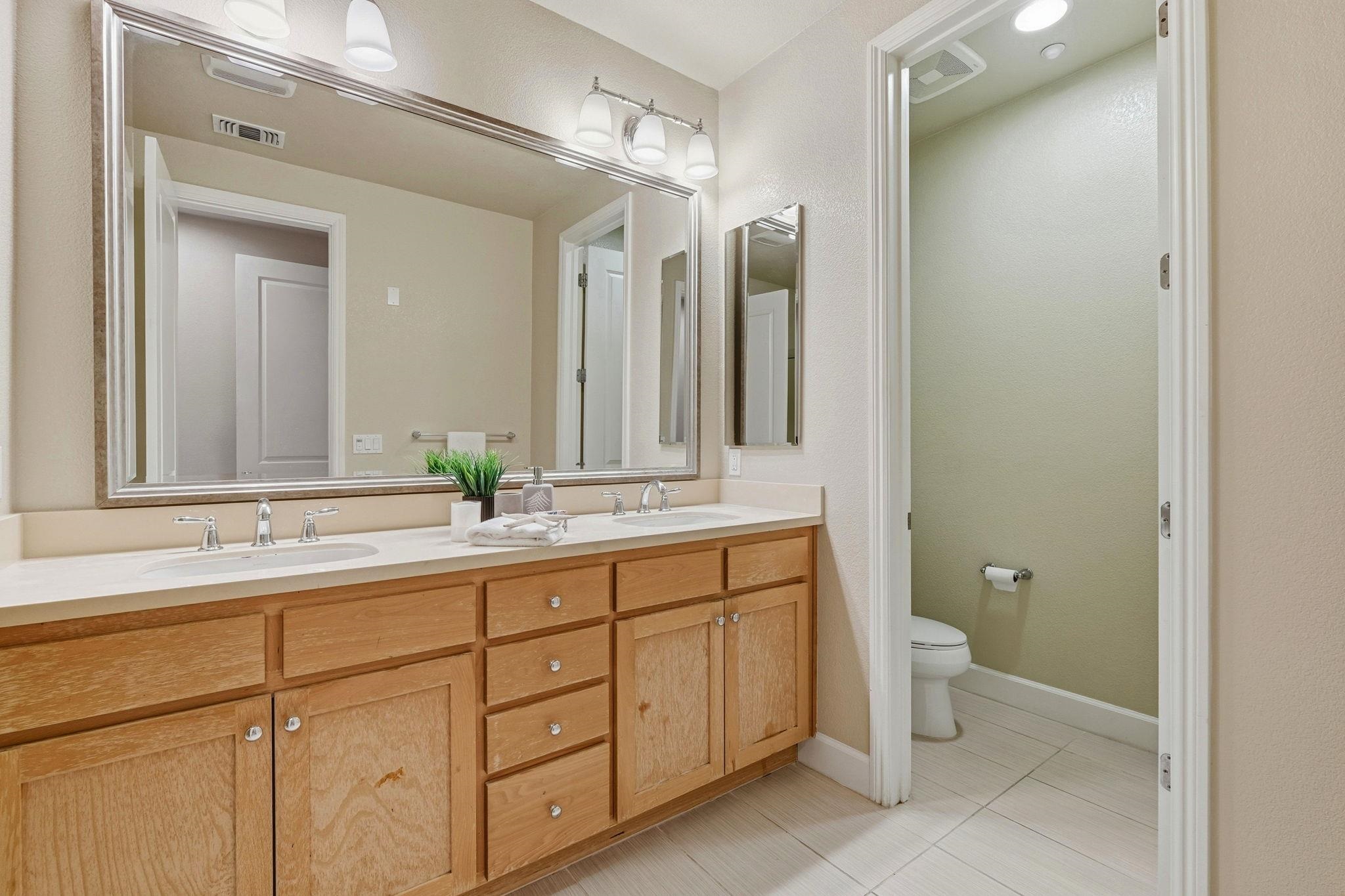 2863 Finca Terrace Fremont, CA 94539 - Photo 26 of 37 a bathroom with a double vanity sink and a mirror
