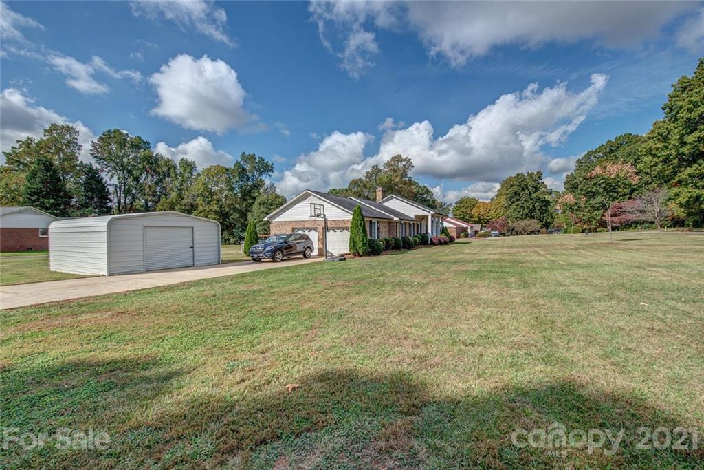 2103 Heavner Road Lincolnton, NC 28092 - Photo 2 of 25 a view of a house with a yard and garage