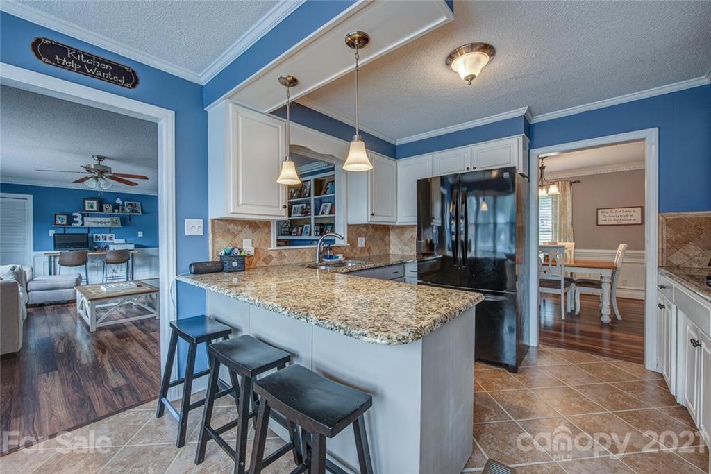 2103 Heavner Road Lincolnton, NC 28092 - Photo 13 of 25 a kitchen with center island table and chairs