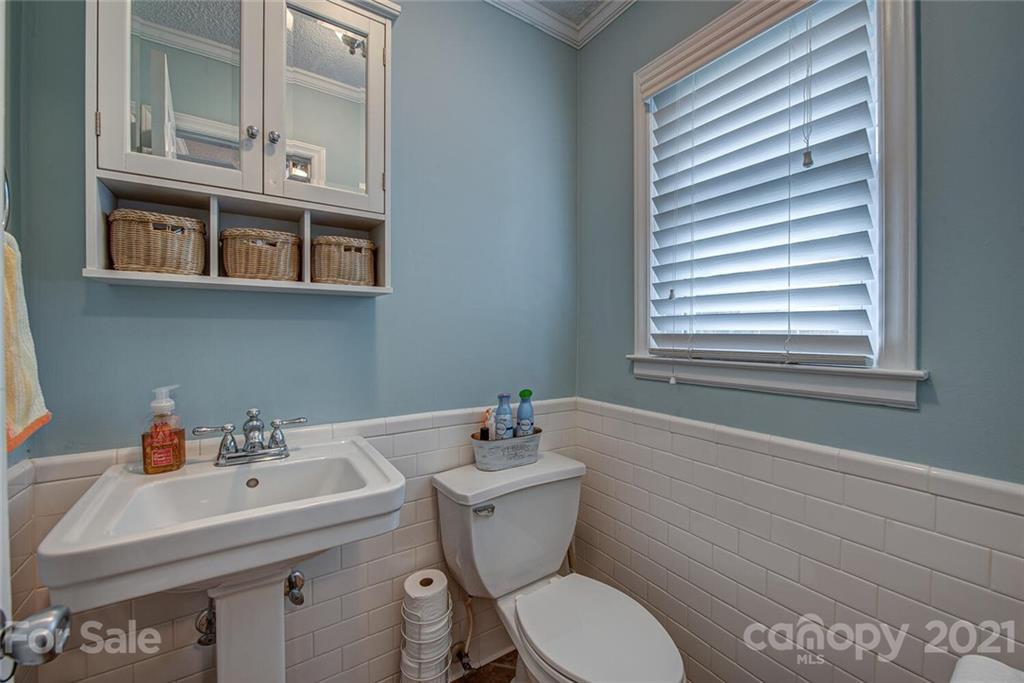 2103 Heavner Road Lincolnton, NC 28092 - Photo 20 of 25 a bathroom with a sink a toilet and a mirror