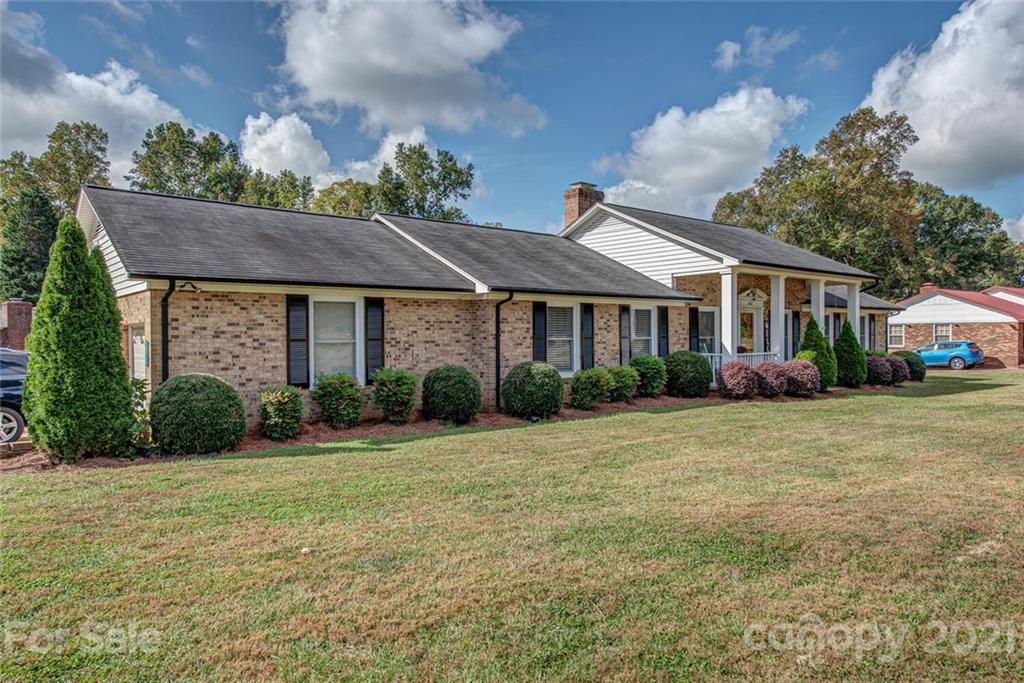 2103 Heavner Road Lincolnton, NC 28092 - Photo 3 of 25 a front view of a house with a garden