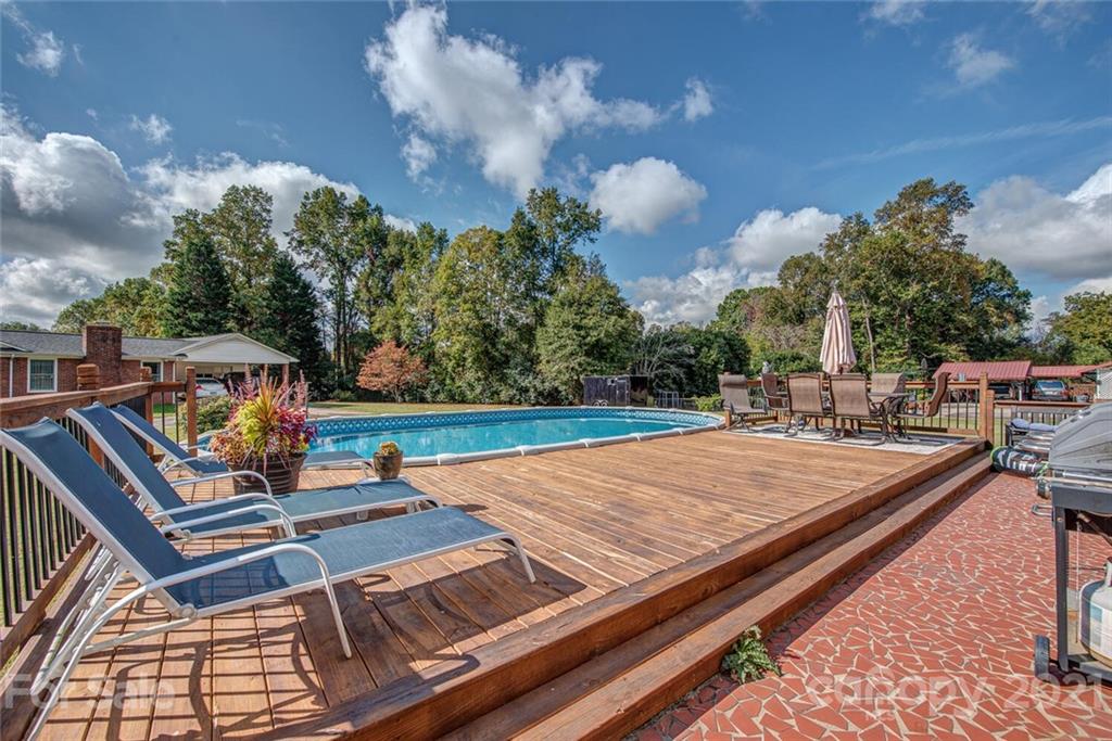 2103 Heavner Road Lincolnton, NC 28092 - Photo 23 of 25 a view of a tennis ground with large trees
