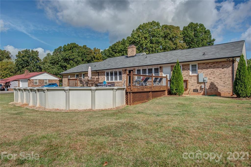 2103 Heavner Road Lincolnton, NC 28092 - Photo 24 of 25 a house view with a garden and deck
