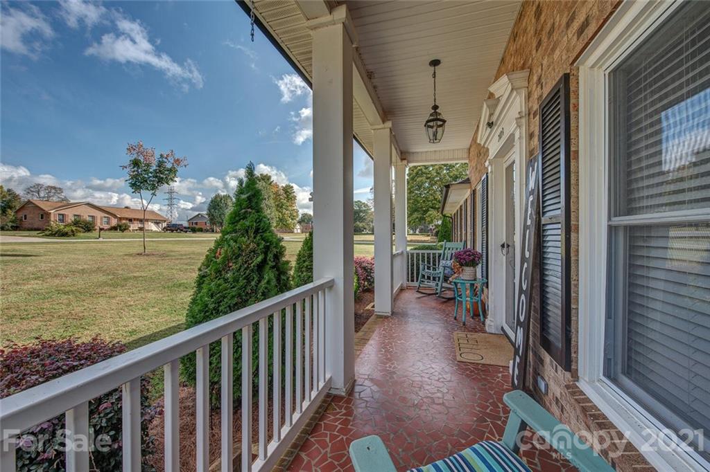 2103 Heavner Road Lincolnton, NC 28092 - Photo 4 of 25 a view of a balcony with chairs and wooden floor