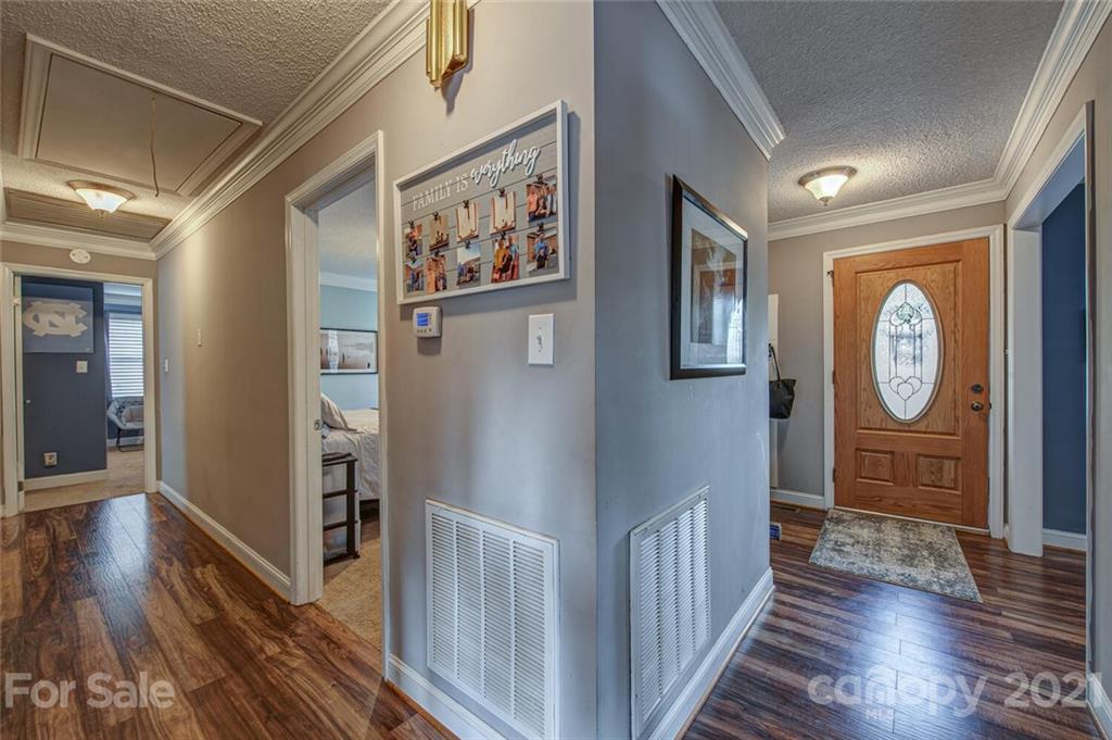 2103 Heavner Road Lincolnton, NC 28092 - Photo 5 of 25 a view of a hallway with wooden floor