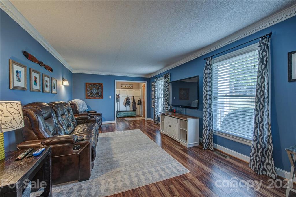 2103 Heavner Road Lincolnton, NC 28092 - Photo 7 of 25 a living room with furniture and a flat screen tv