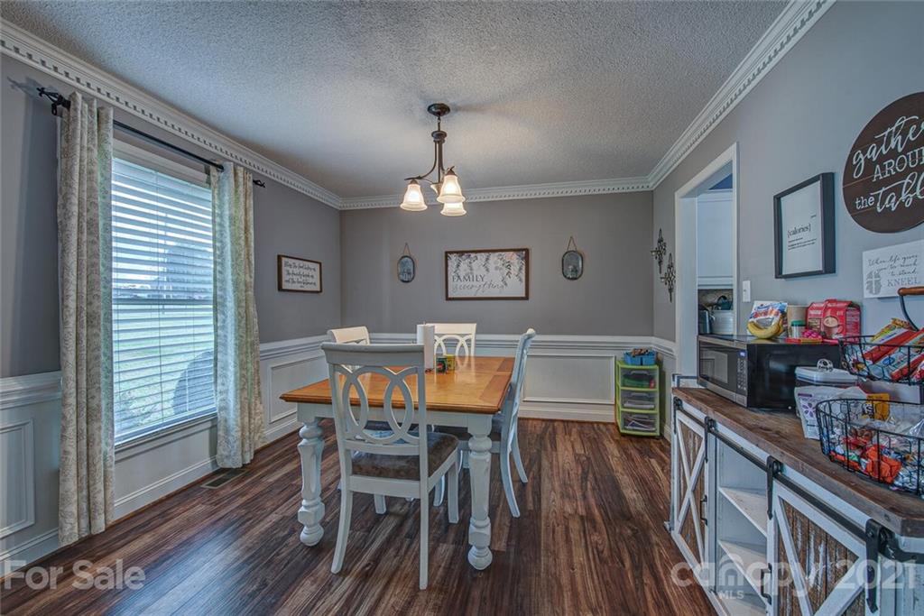 2103 Heavner Road Lincolnton, NC 28092 - Photo 8 of 25 a view of a dining room with furniture window and wooden floor