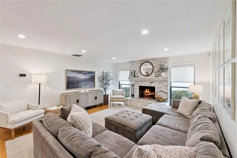 a living room with furniture and a rug