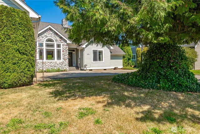 a front view of a house with garden