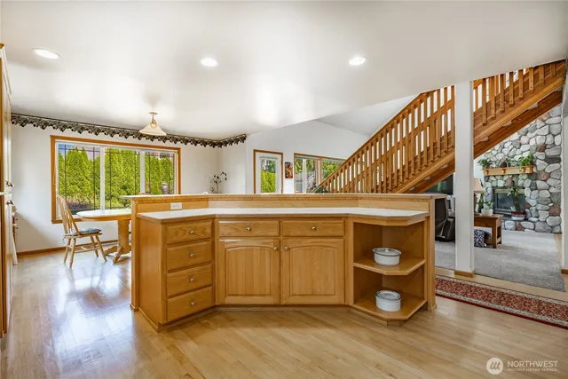 a kitchen with a stove a sink and a refrigerator
