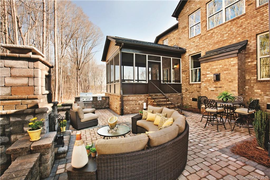 2016 Flowering Peach Road, Unit 68 Marvin, NC 28173 - Photo 12 of 14 a view of a patio with couches table and chairs and potted plants