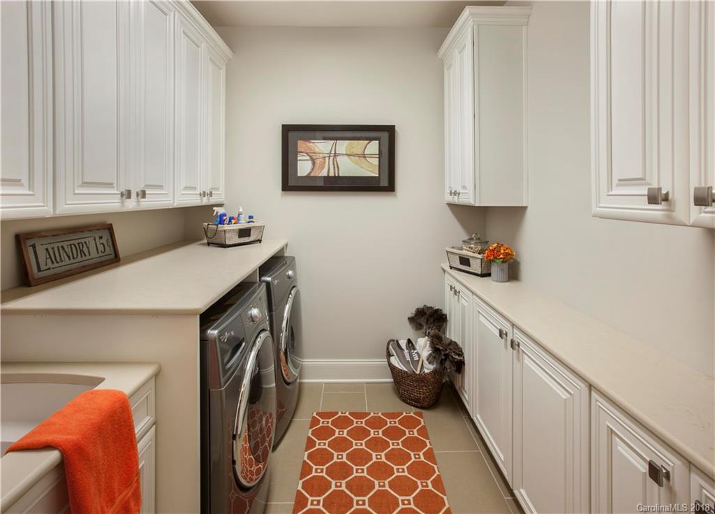 2016 Flowering Peach Road, Unit 68 Marvin, NC 28173 - Photo 7 of 14 a utility room with sink dryer and washer