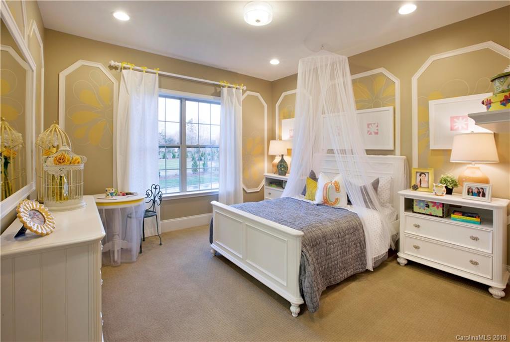 2016 Flowering Peach Road, Unit 68 Marvin, NC 28173 - Photo 10 of 14 a spacious bedroom with a bed and a dresser