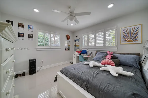 a bedroom with a bed and furniture