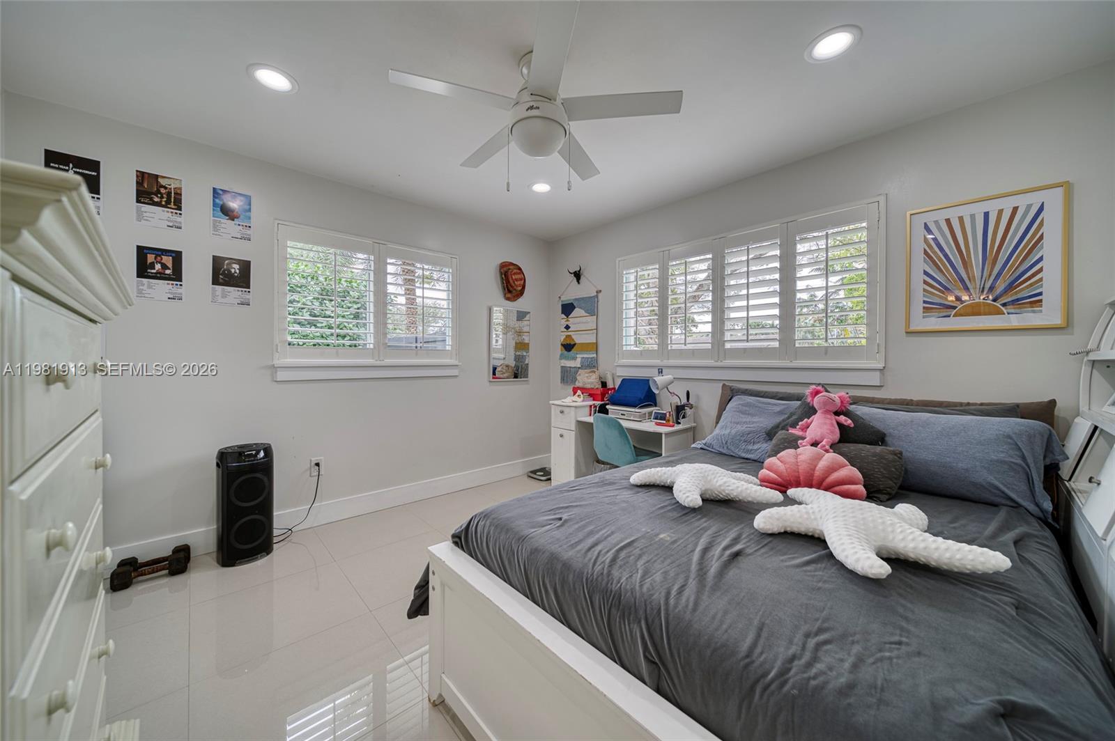 10131 Southwest 108th Street Miami, FL 33176 - Photo 12 of 21 a bedroom with a bed and wooden floor