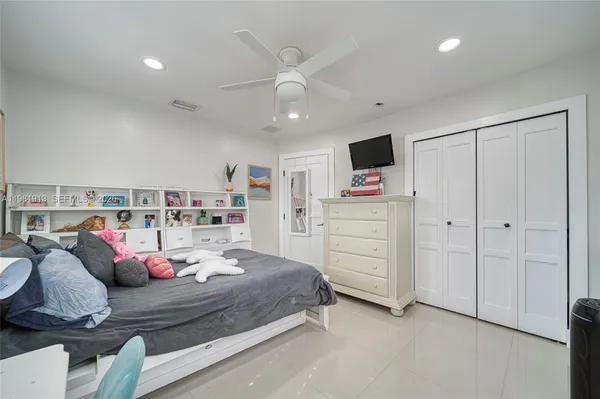 a bathroom with a double vanity sink toilet and a shower