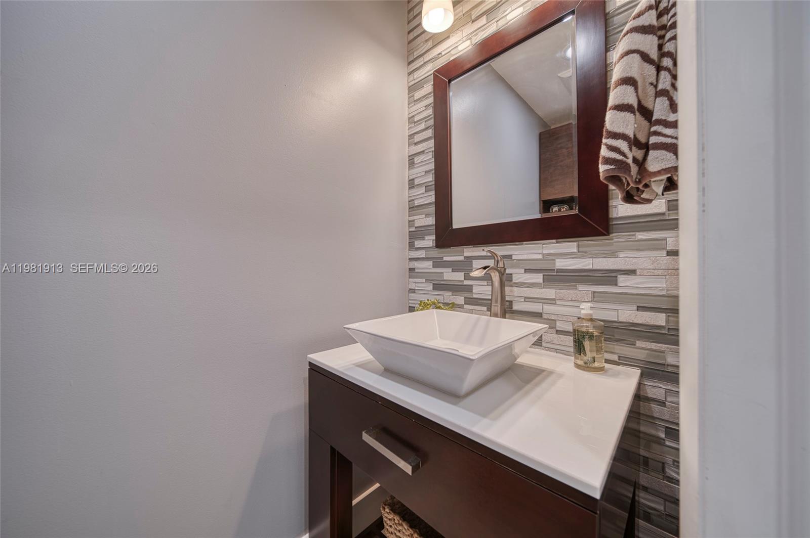 10131 Southwest 108th Street Miami, FL 33176 - Photo 20 of 21 a bathroom with a sink and a mirror