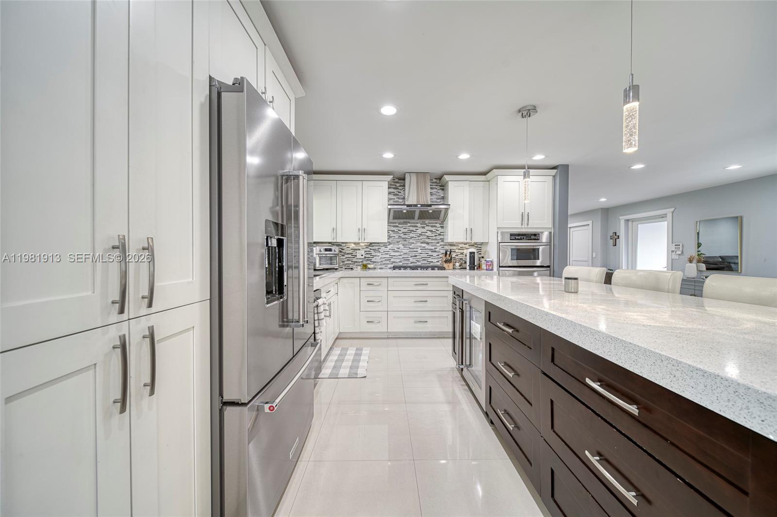 10131 Southwest 108th Street Miami, FL 33176 - Photo 7 of 21 a large white kitchen with a large window