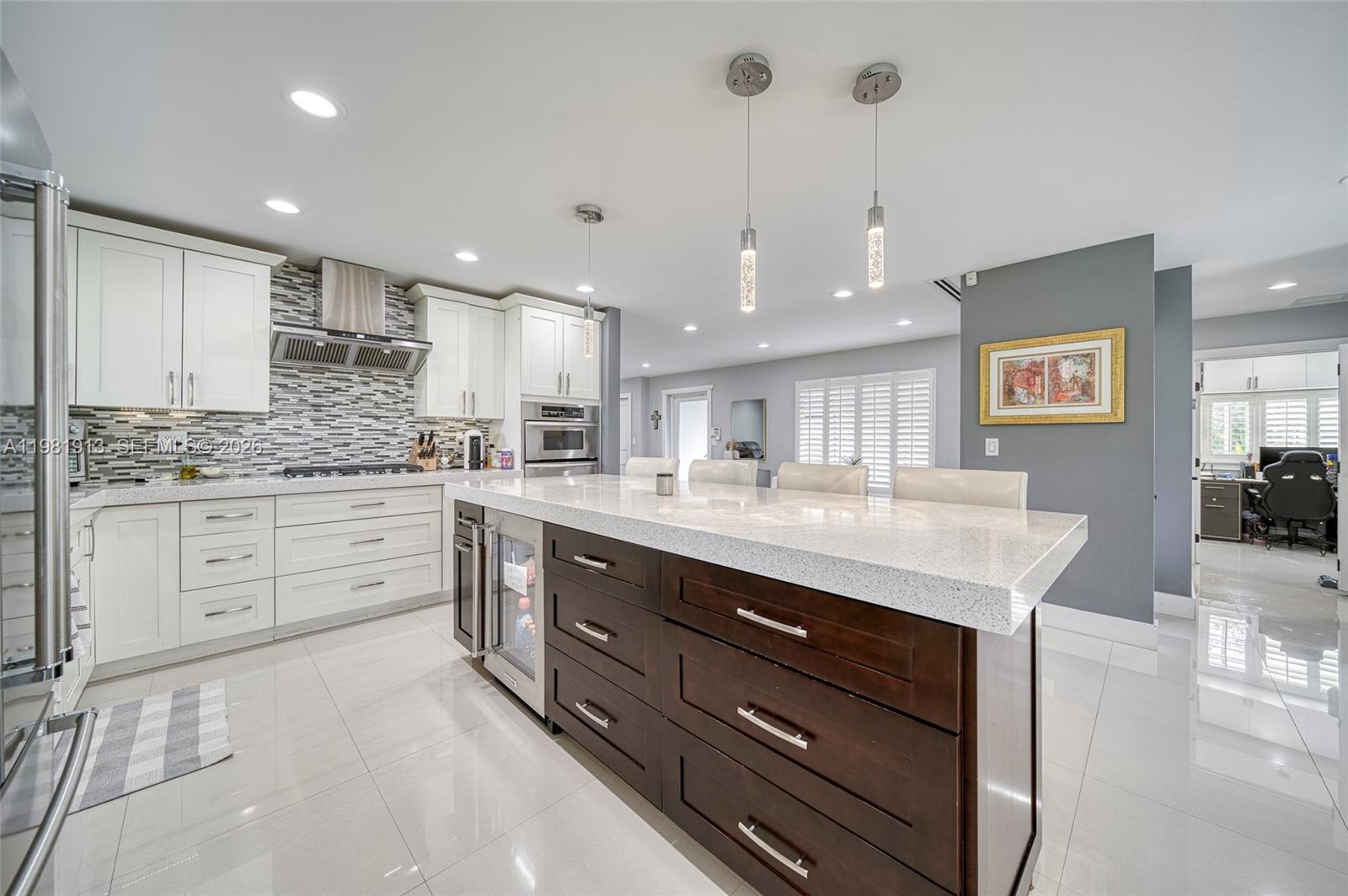10131 Southwest 108th Street Miami, FL 33176 - Photo 8 of 21 a kitchen with a sink stainless steel appliances and cabinets