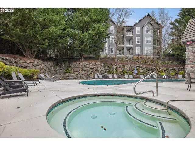 a view of swimming pool with a outdoor seating