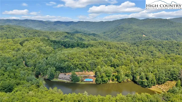 a living room with lots of furniture and wooden floor