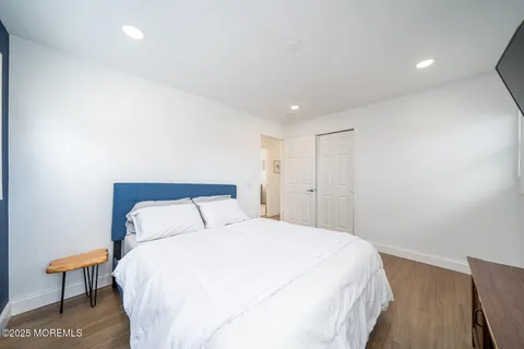 a bedroom with a bed and a lamp