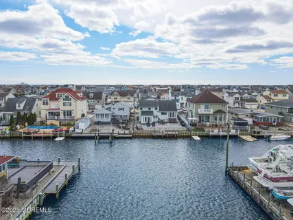 a view of a street with cars parked