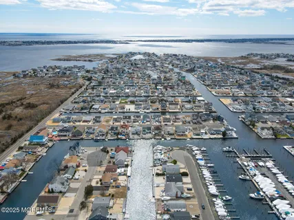 an aerial view of a residential building with swimming pool