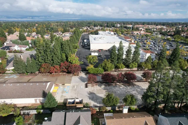 an aerial view of house with ocean view