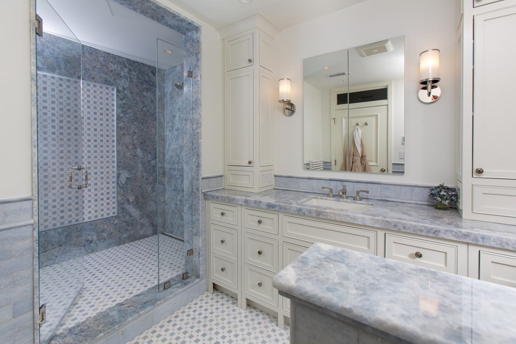 2 Commonwealth Avenue, Unit PH 3/4 Boston, MA 02215 - Photo 26 of 29 a bathroom with a granite countertop sink a mirror and a bathtub