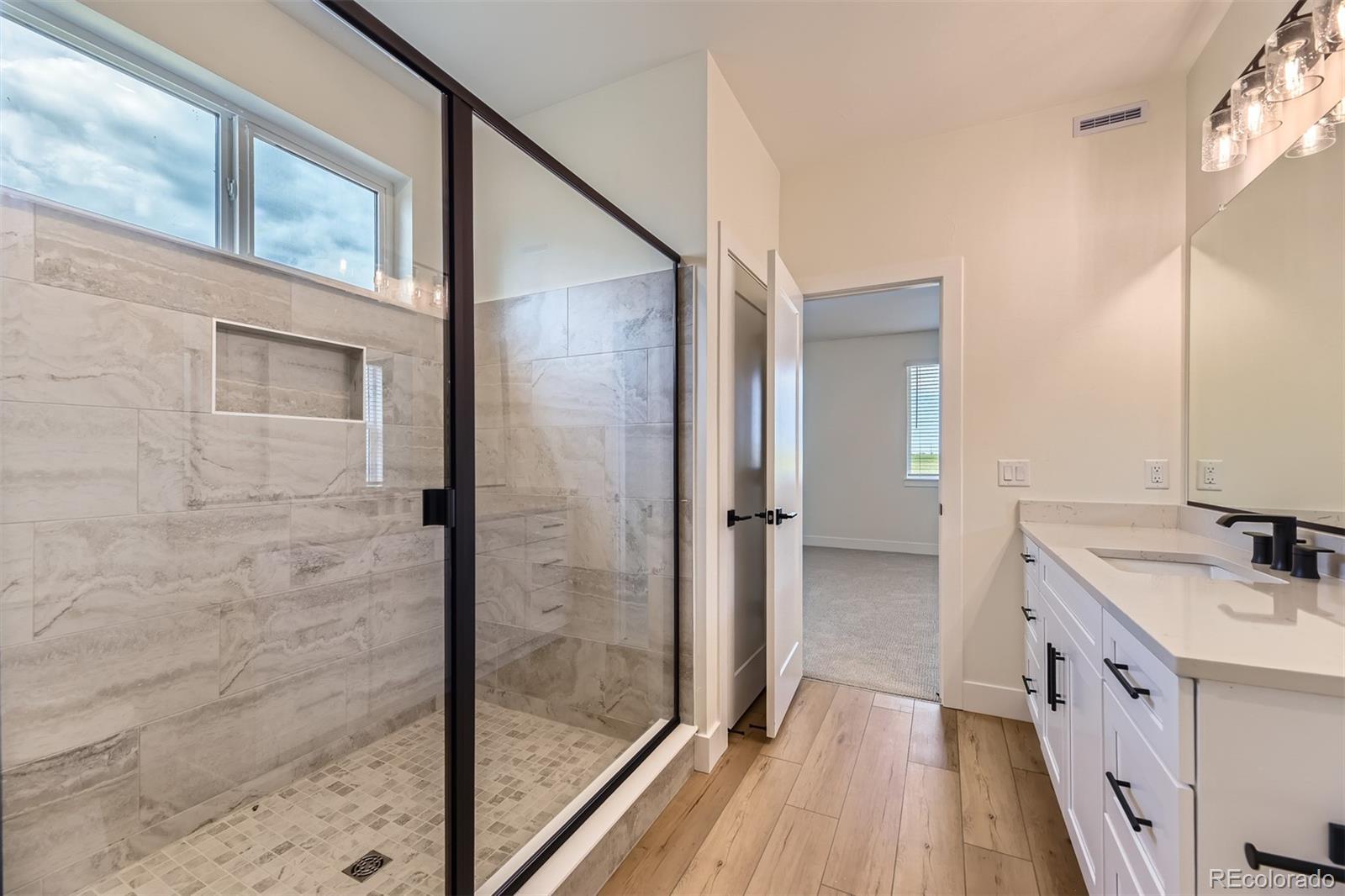 42966 Colonial Trail Elizabeth, CO 80107 - Photo 19 of 29 a bathroom with a sink and a mirror