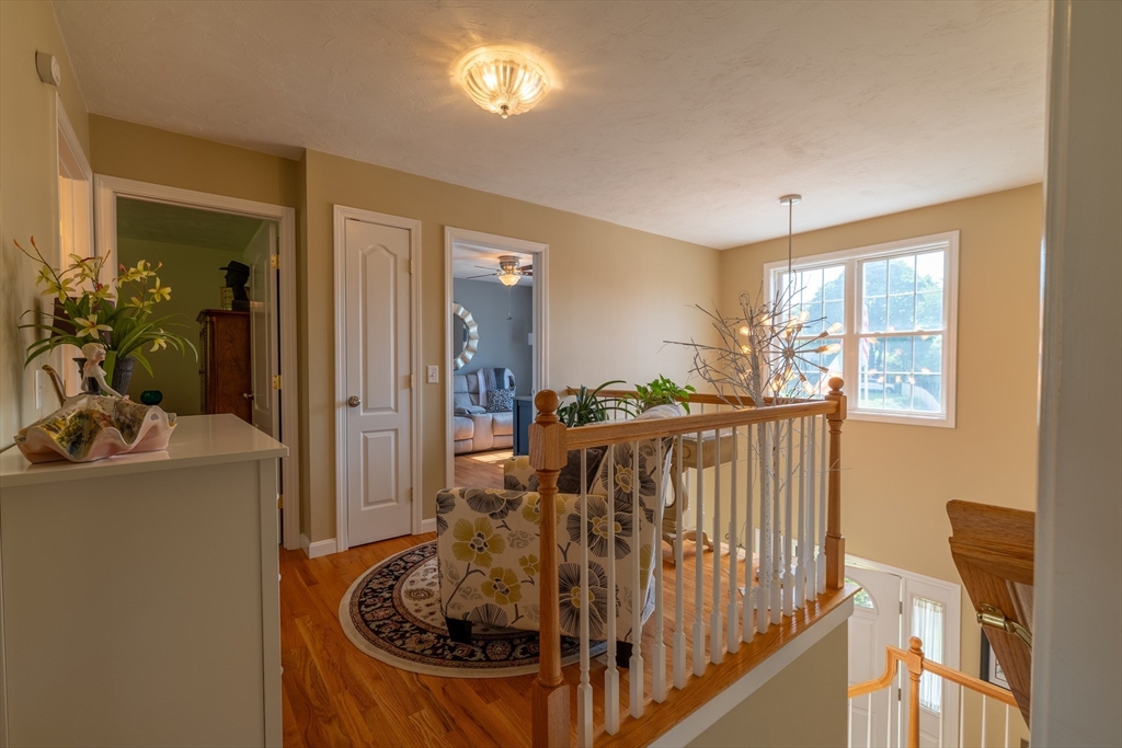 22 Duluth Street Worcester, MA 01604 - Photo 22 of 35 a view of a livingroom with furniture hardwood floor and a ceiling fan