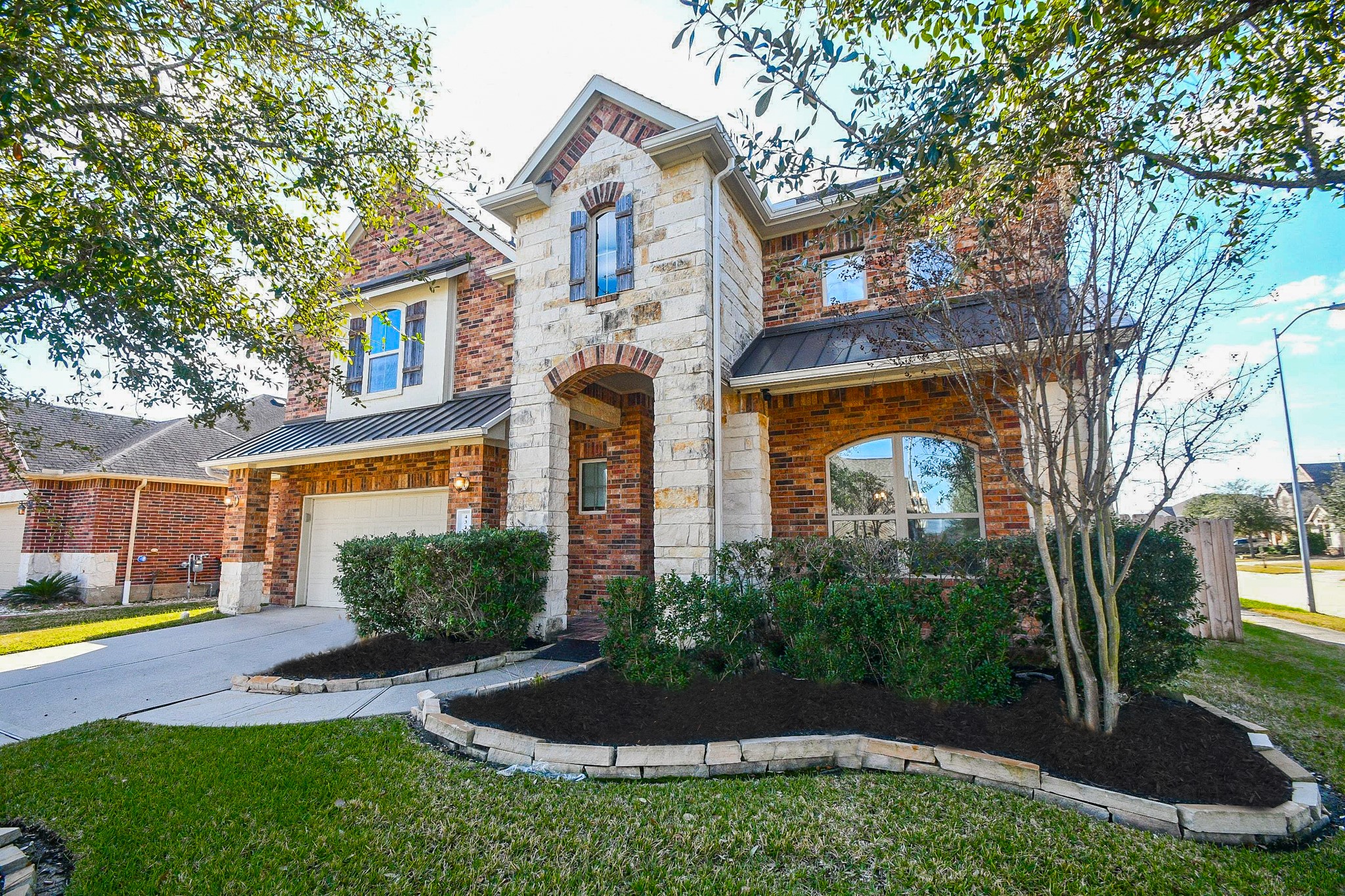 4331 Estes Ridge Lane Katy, TX 77493 - Photo 1 of 42 a front view of a house with garden