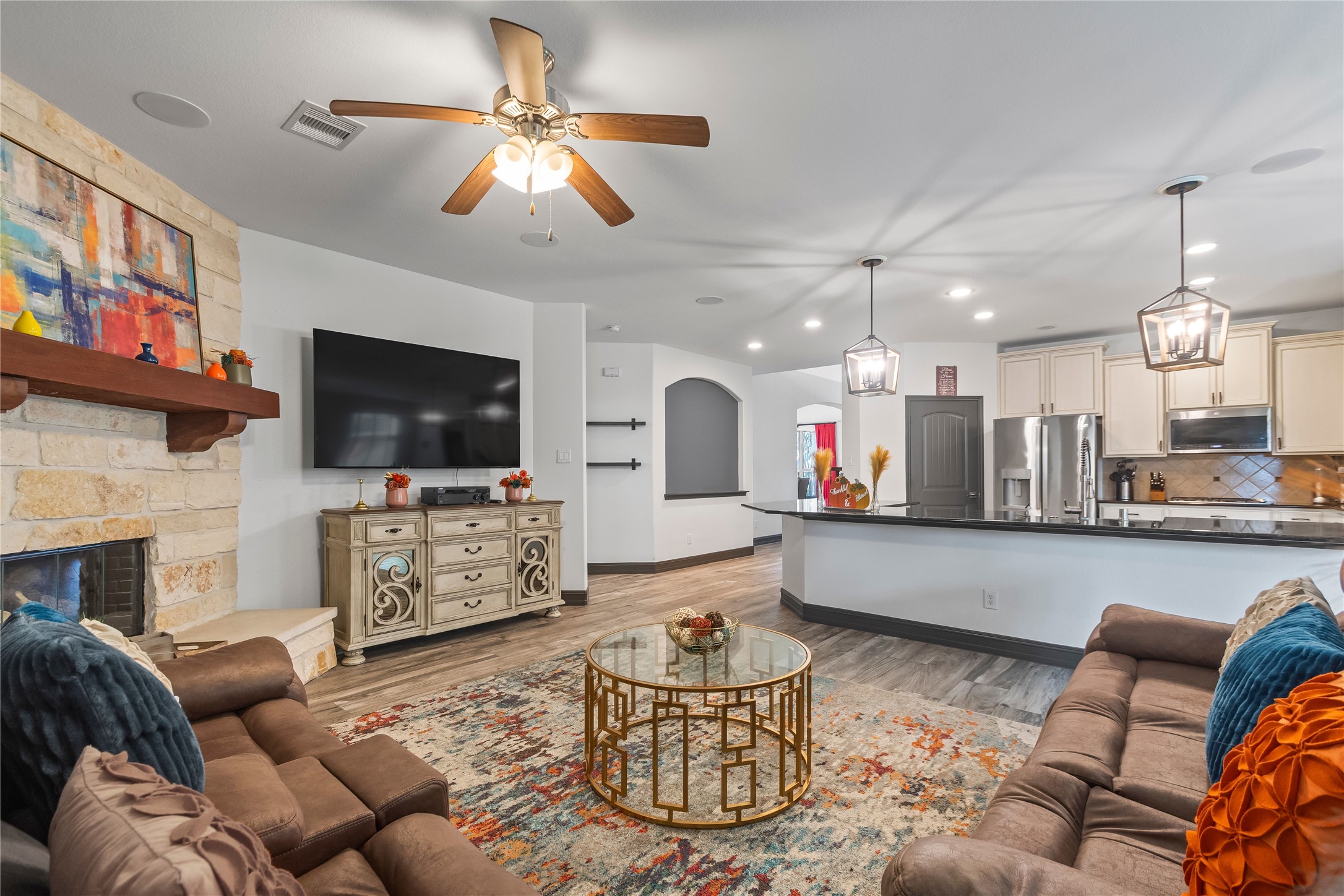 4331 Estes Ridge Lane Katy, TX 77493 - Photo 11 of 42 a living room with fireplace furniture and a flat screen tv
