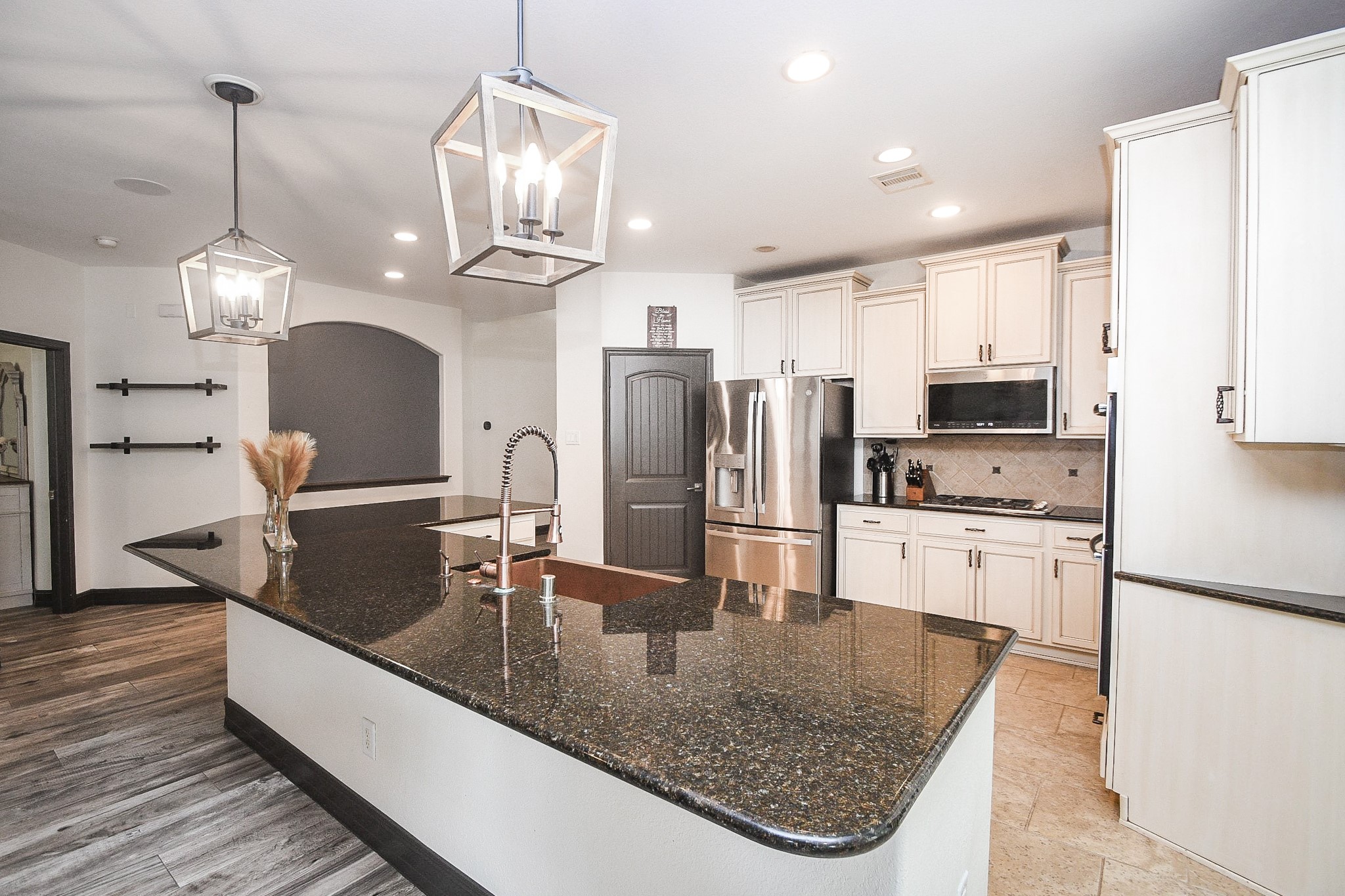 4331 Estes Ridge Lane Katy, TX 77493 - Photo 14 of 42 a kitchen with stainless steel appliances granite countertop a sink refrigerator and cabinets