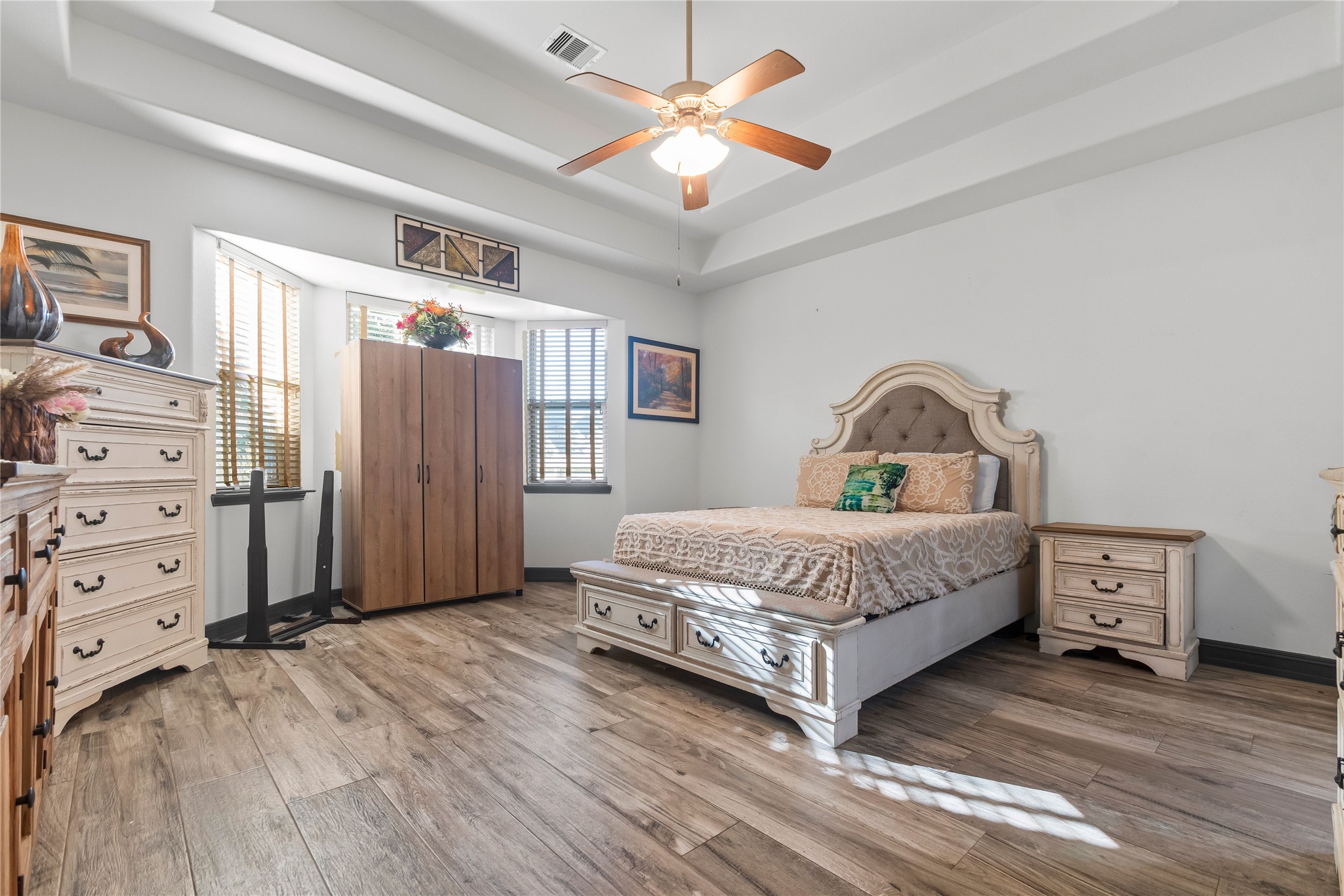 4331 Estes Ridge Lane Katy, TX 77493 - Photo 17 of 42 a spacious bedroom with a bed and a dresser