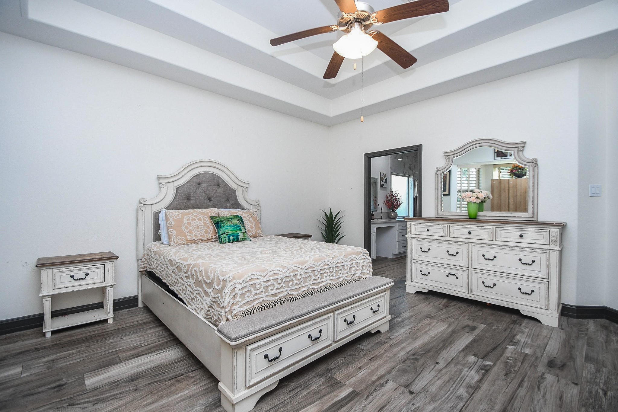 4331 Estes Ridge Lane Katy, TX 77493 - Photo 19 of 42 a bedroom with a bed and a dresser