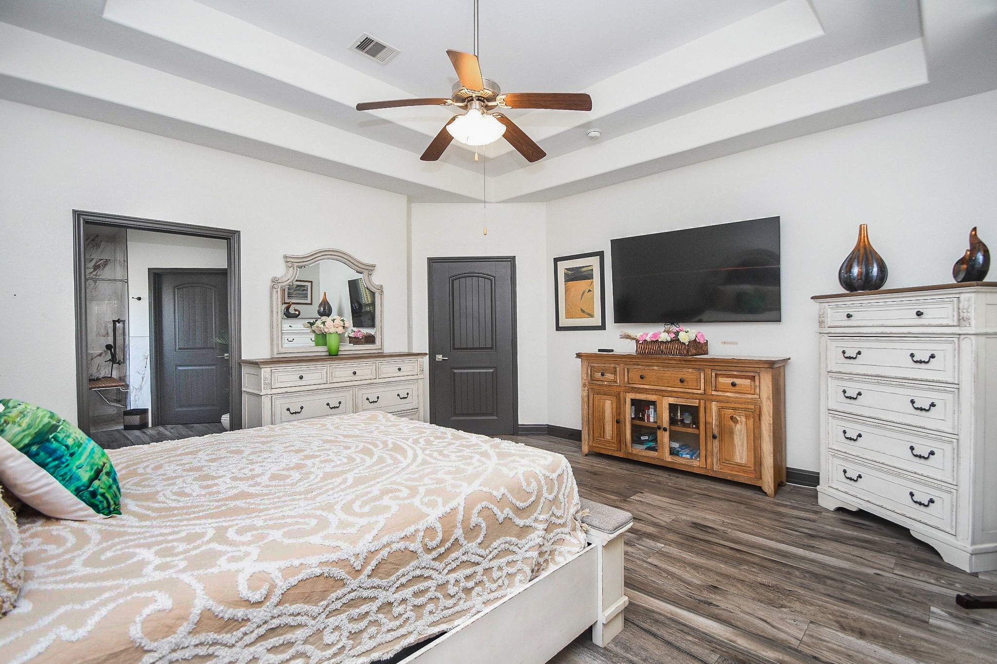 4331 Estes Ridge Lane Katy, TX 77493 - Photo 20 of 42 a bedroom with a bed and a flat screen tv